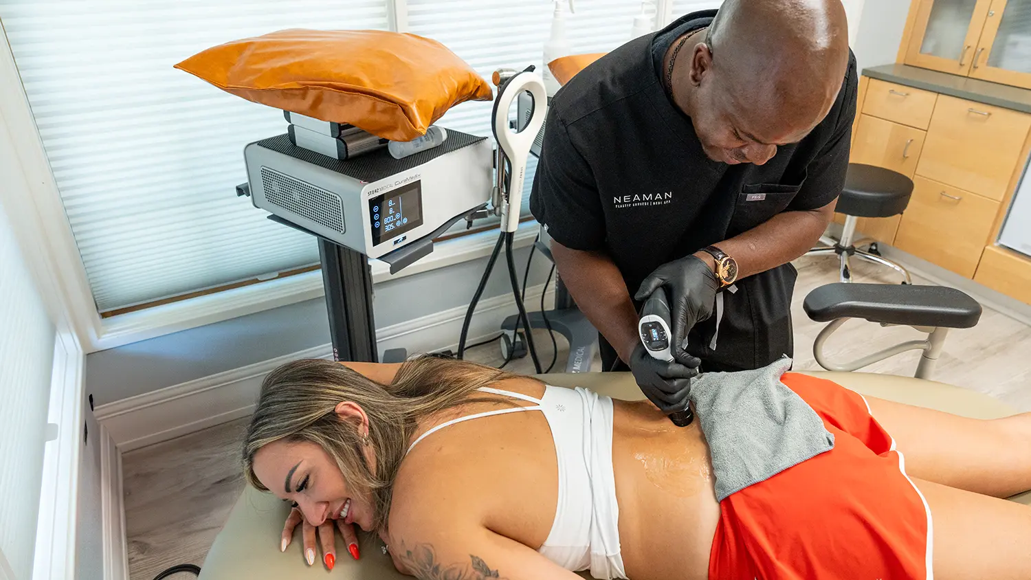 woman lying on her stomach receiving care