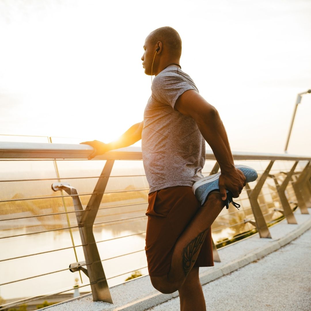 man exercising in salem oregon on a bridge overlooking water