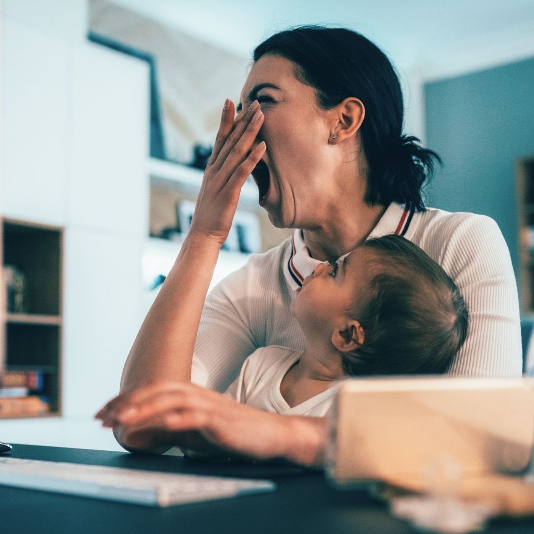 woman yawning and tired