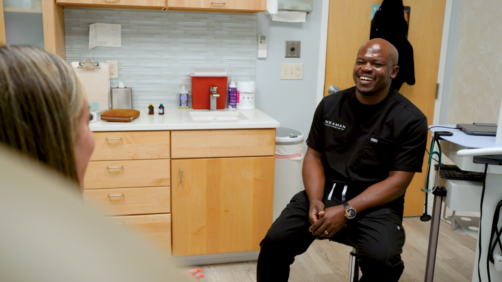 Doctor laughs with a patient during a wolverine peptide consultation