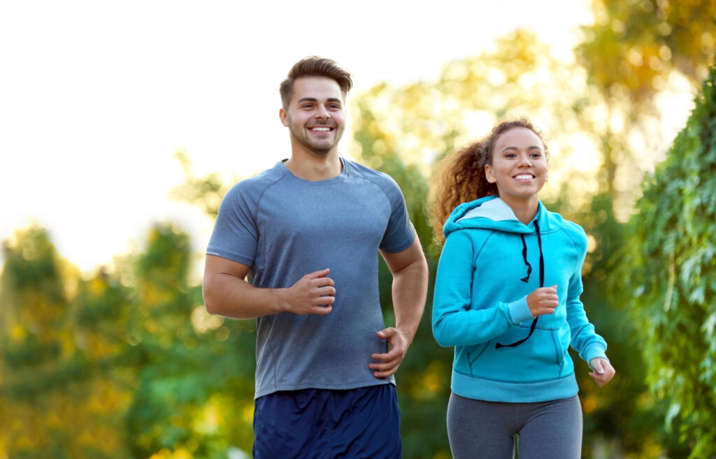 Fit man and woman jogging