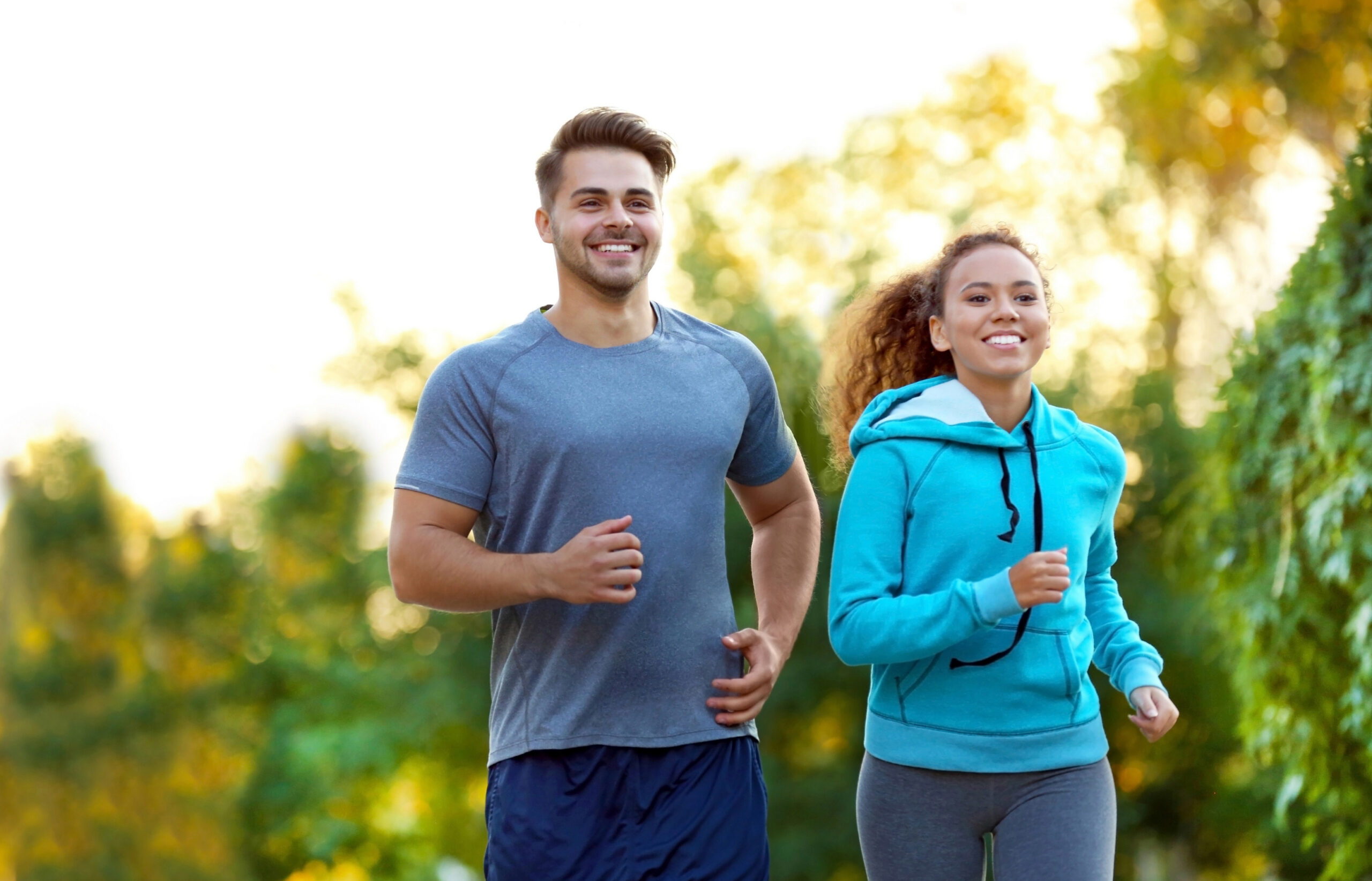Fit man and woman jogging